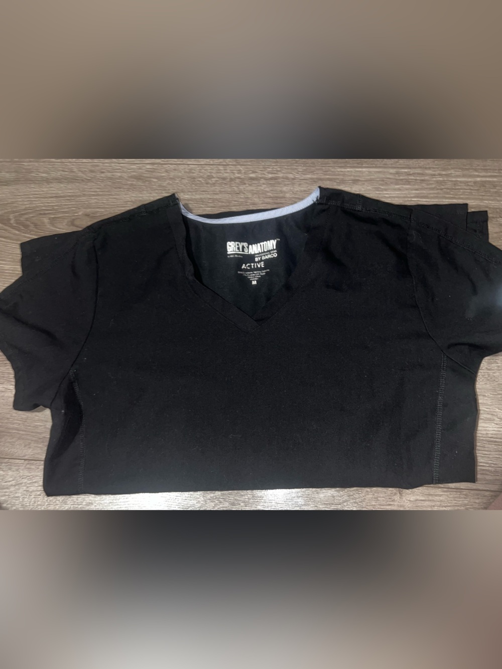 Grey's Anatomy woman’s Black Short Sleeve V‑Neck scrub top